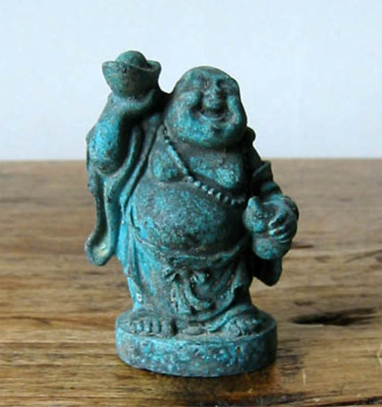 Smiling buddha holding an ingot (bronze)